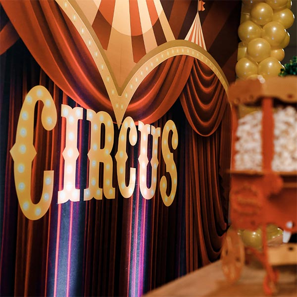 Circus stage with purple drapes for a themed circus party