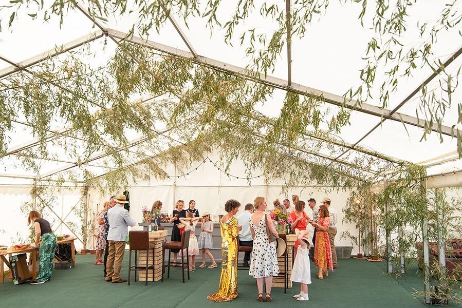 clearspan marquee with willow branches used to decorate the ceiling