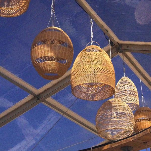 Rattan lanterns in marquee for natural party decor